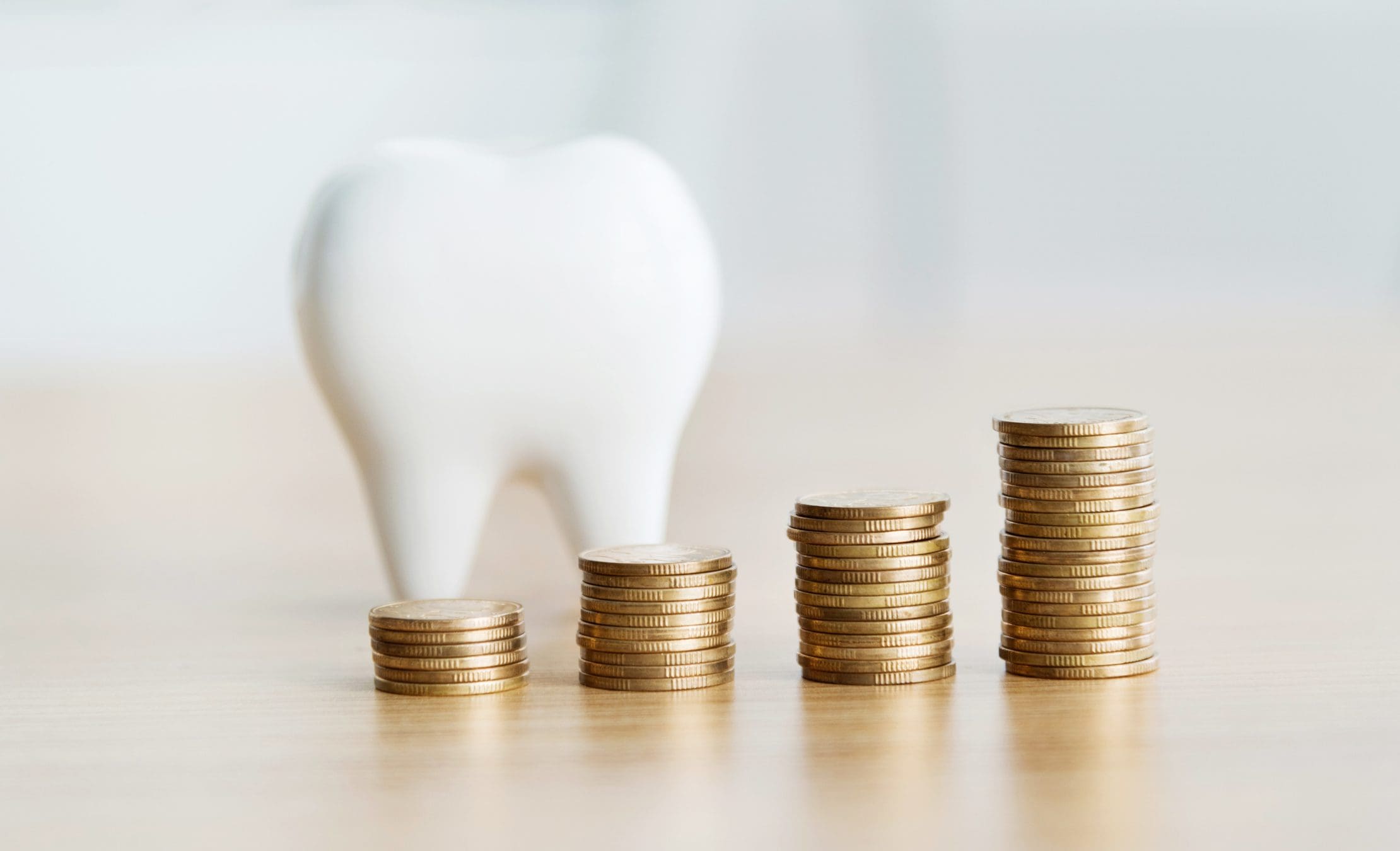 Tooth model with stacked coins increasing.