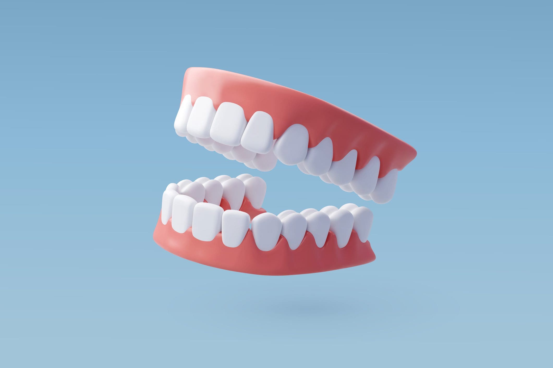 Floating dentures on a blue background.