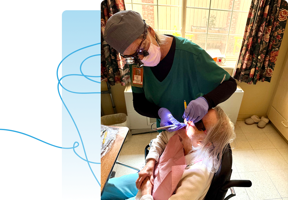 Dental hygienist examining elderly woman in chair
