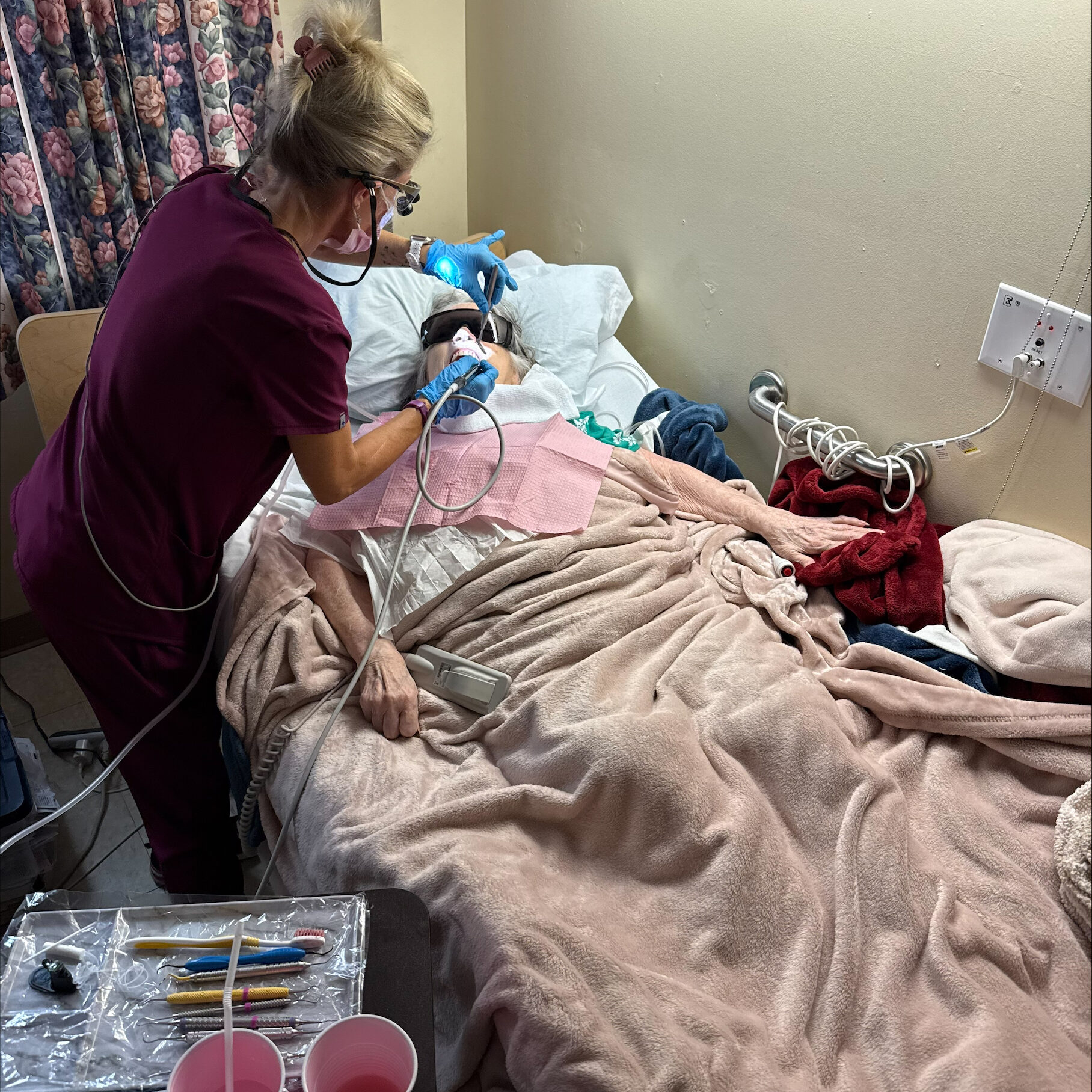 Nurse providing bedside care to patient